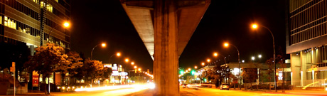 Vehicles speeding alongside boulevard